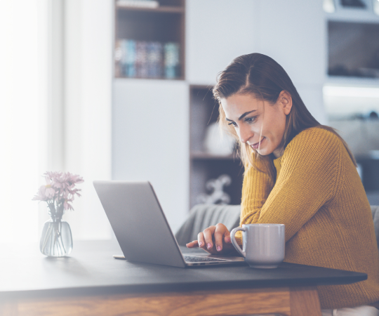 woman at a desk on laptop